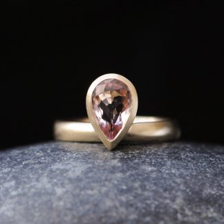 Pale pink pear cut morganite ring in gold. By William White.