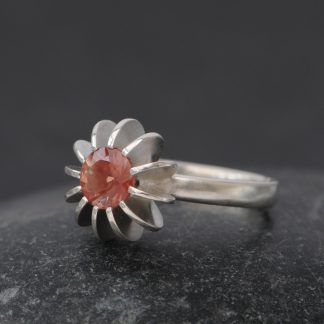 Peach sunstone set in sea urchin design silver ring