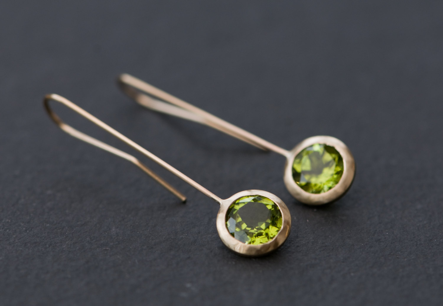 Beautiful green peridot and gold 'Lollipop' earrings. Apple green peridot set in 18k yellow gold. Designed and handmade by William White in Cornwall, UK
