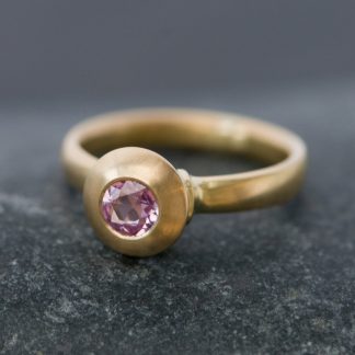 pink sapphire solitaire in gold ring
