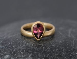 Pear cut pink tourmaline set in recycled gold ring