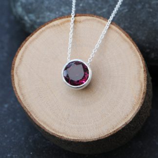 Lovely deep pink rhodolite garnet, set in satin finished sterling silver pendant. Clean and simple designed and handmade by William White in Cornwall, UK.