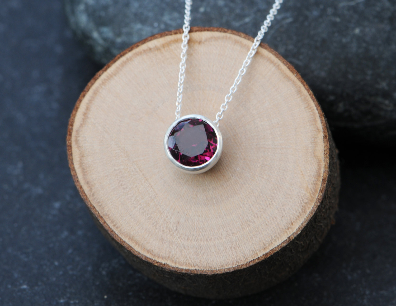 Lovely deep pink rhodolite garnet, set in satin finished sterling silver pendant. Clean and simple designed and handmade by William White in Cornwall, UK.