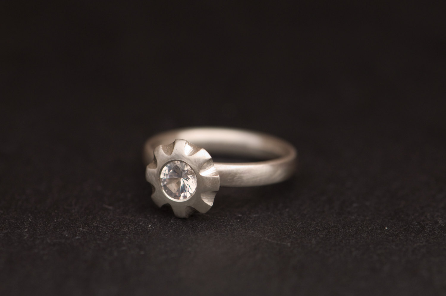white topaz flower ring in satin finished silver
