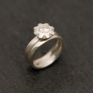 White topaz wedding set featuring topaz flower ring and wedding band in sterling silver