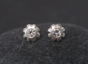 Simple White topaz flower earrings, set in sterling silver. Earrings 10mm across, stones 5mm across. Designed and handmade by William White in Cornwall, UK