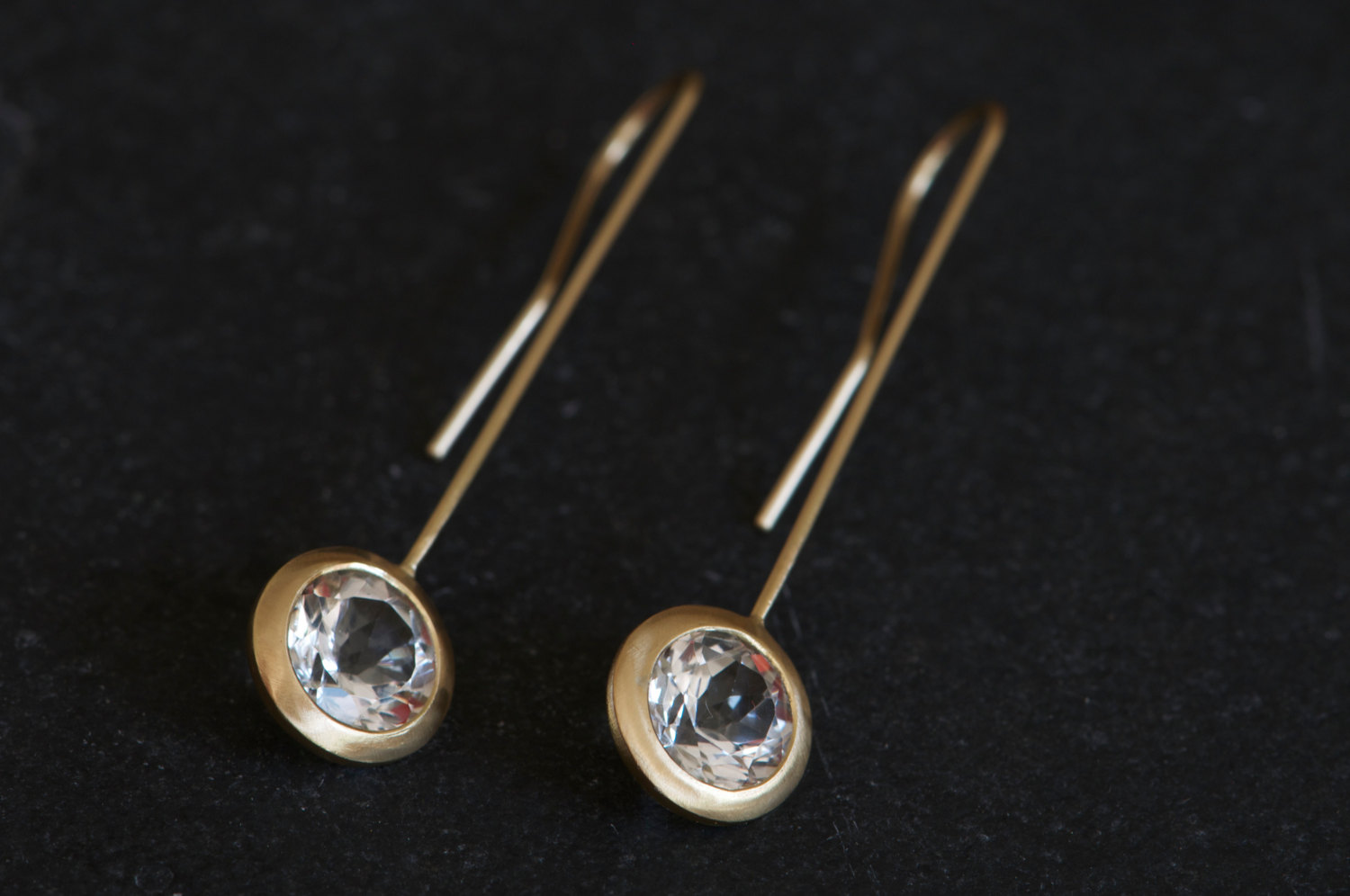 Clean and simple gold and white topaz 'lollipop' earrings. Sparkly white topaz set in 18k gold. Designed and handmade by William White in Cornwall, UK