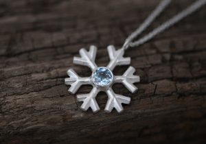 Lovely and sparkly aquamarine snowflake, set in sterling silver on a fine silver necklace, by William White