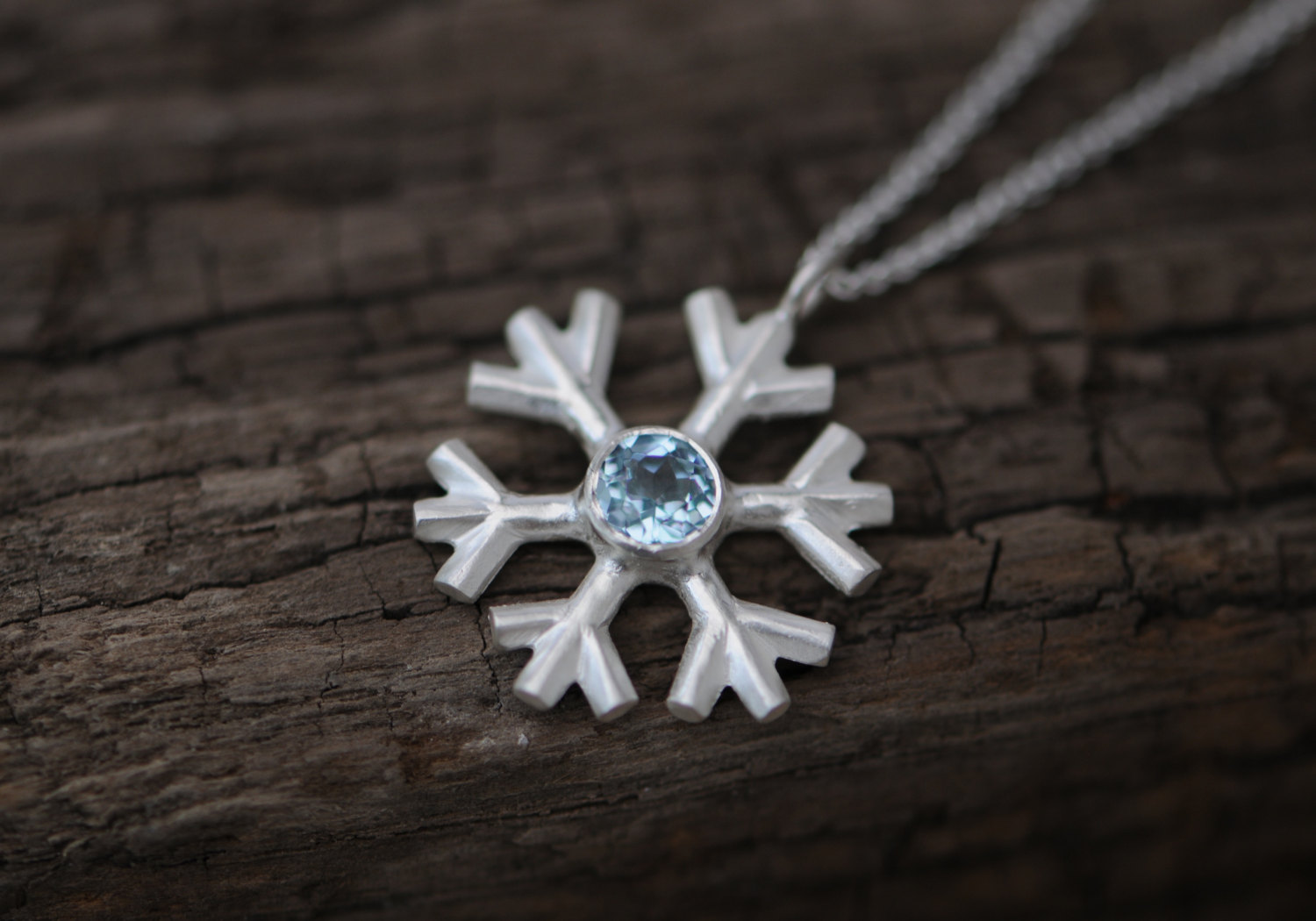 Lovely and sparkly aquamarine snowflake, set in sterling silver on a fine silver necklace, by William White