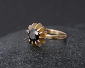 black diamond solitaire set in 18k gold sea urchin