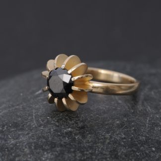 black diamond solitaire set in 18k gold sea urchin