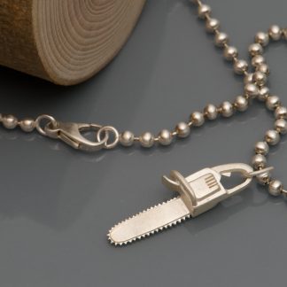 Chainsaw 'killer charm' pendant in solid silver, on a sterling silver ball chain necklace. 'Killer Charm' collection designed and handmade by William White.