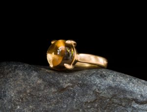 large yellow citrine cabochon claw set in gold ring