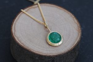 Beautiful emerald cabochon lollipop pendant necklace, set in 18k gold on a gold chain. Designed and handmade in Cornwall, UK by William White
