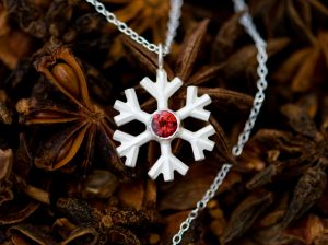 Garnet snowflake necklace, set in sterling silver on a fine silver chain. Lovely gift for a winter bride. Designed & handmade by William White in Cornwall.