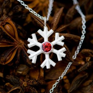 Garnet snowflake necklace, set in sterling silver on a fine silver chain. Lovely gift for a winter bride. Designed & handmade by William White in Cornwall.
