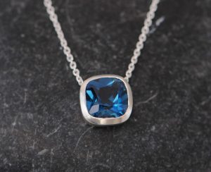 Cushion cut pendant with London Blue Topaz square stone set in silver on sterling silver chain.