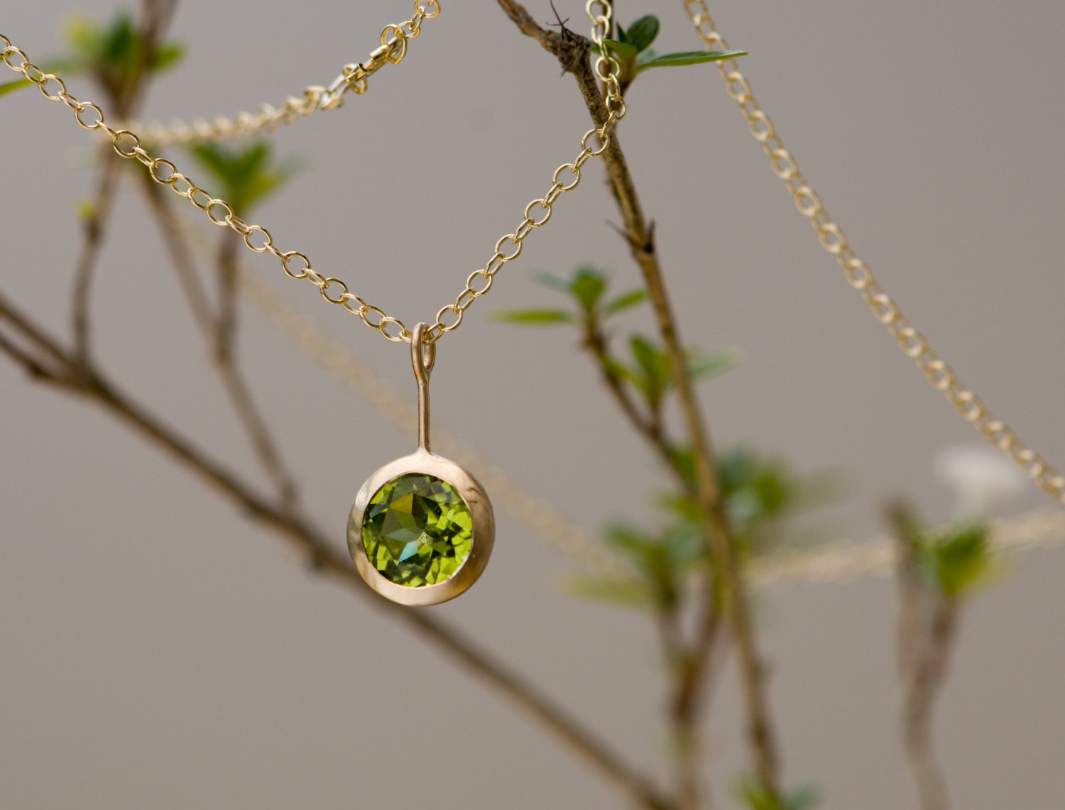 Green Peridot Lollipop necklace, set in 18k yellow gold on an 18k yellow gold chain. Designed and handmade in Cornwall, UK by William White.