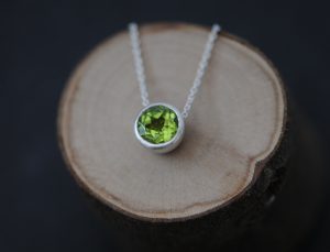 Apple green Peridot necklace in satin finished sterling silver on silver chain. By William White.