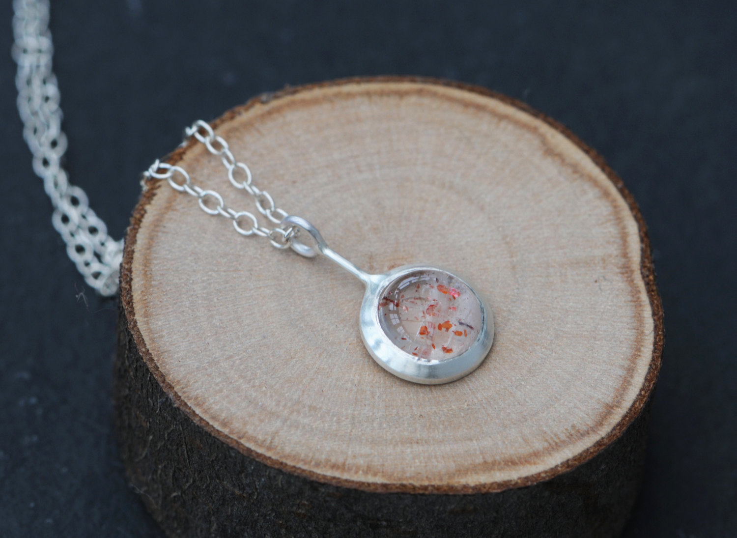 Strawberry quartz 'Lollipop' necklace, set in sterling silver. Strawberry quartz stone is 8mm across and the pendant is 10mm across. By William White