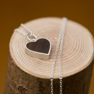 Reclaimed rosewood heart set in silver, on a fine silver necklace. Choice of chain lengths. Designed and handmade by William White in Cornwall, UK
