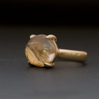 Large rutilated quartz stone claw set in 18k gold ring