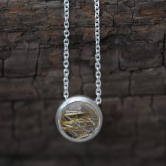 Simple Rutilated Quartz pendant necklace, in sterling silver on a silver chain. Choice of chain lengths. Designed & handmade by William White in Cornwall.