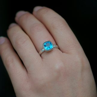 Bright Swiss Blue Topaz stone in silver ring