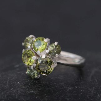 Green gemstones cluster ring claw set in silver