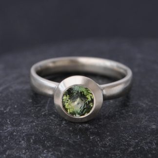 green tourmaline stone set in white gold ring