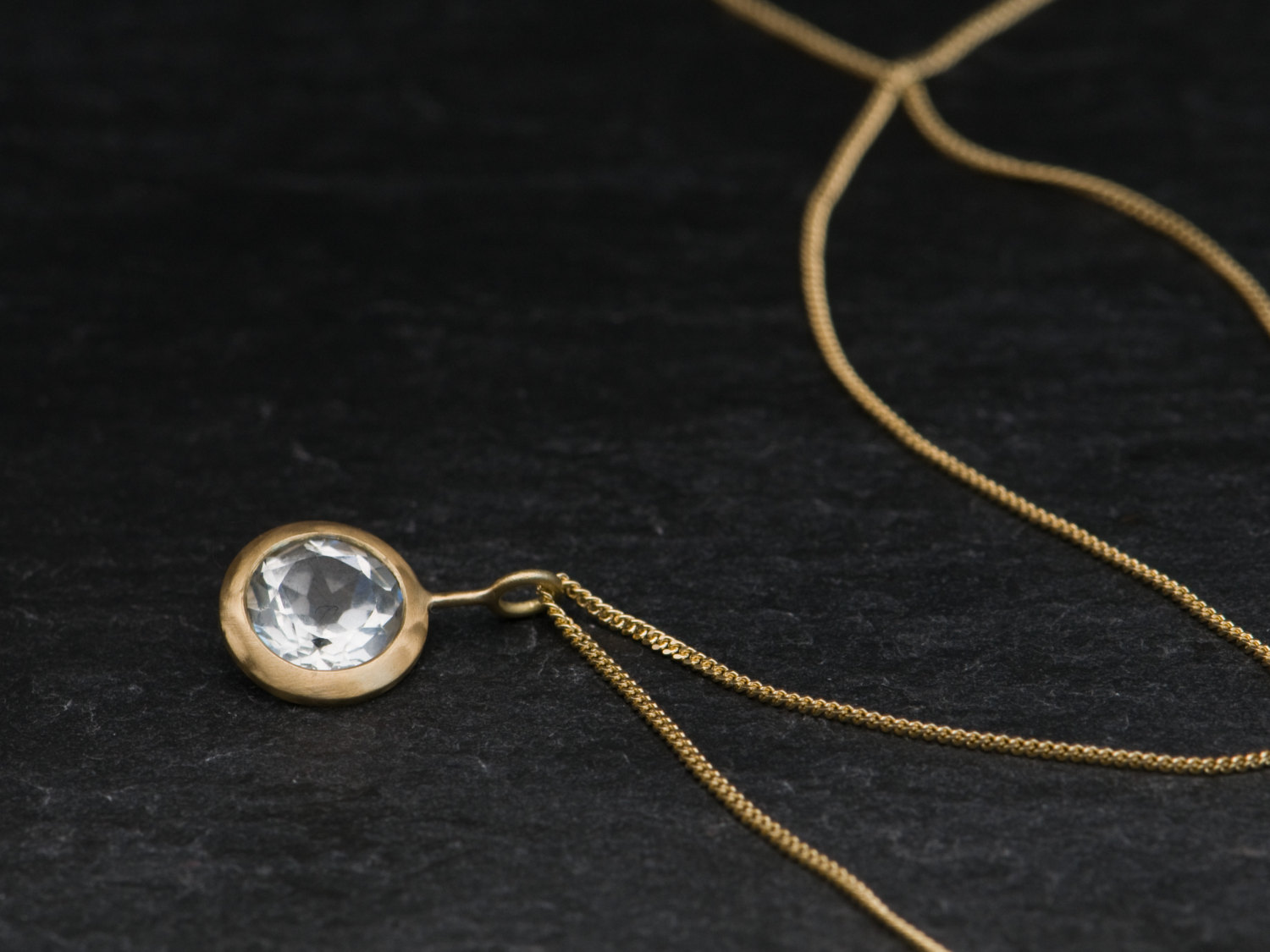 Clean and simple white topaz 'lollipop' necklace, set in 18k yellow gold - on an 18k yellow gold chain by William White