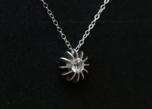 Stunning simple White Topaz sea urchin necklace, set in sterling silver. Designed and handmade in Cornwall, UK by William White.