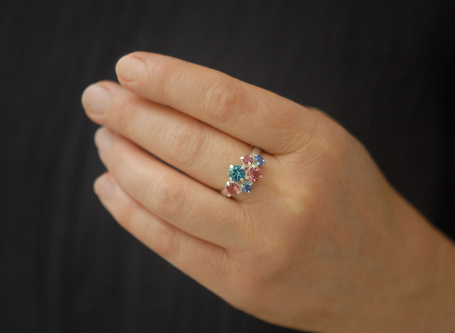 Topaz,-tourmailne-and-sapphire-cluster-ring-in-silver-on-hand