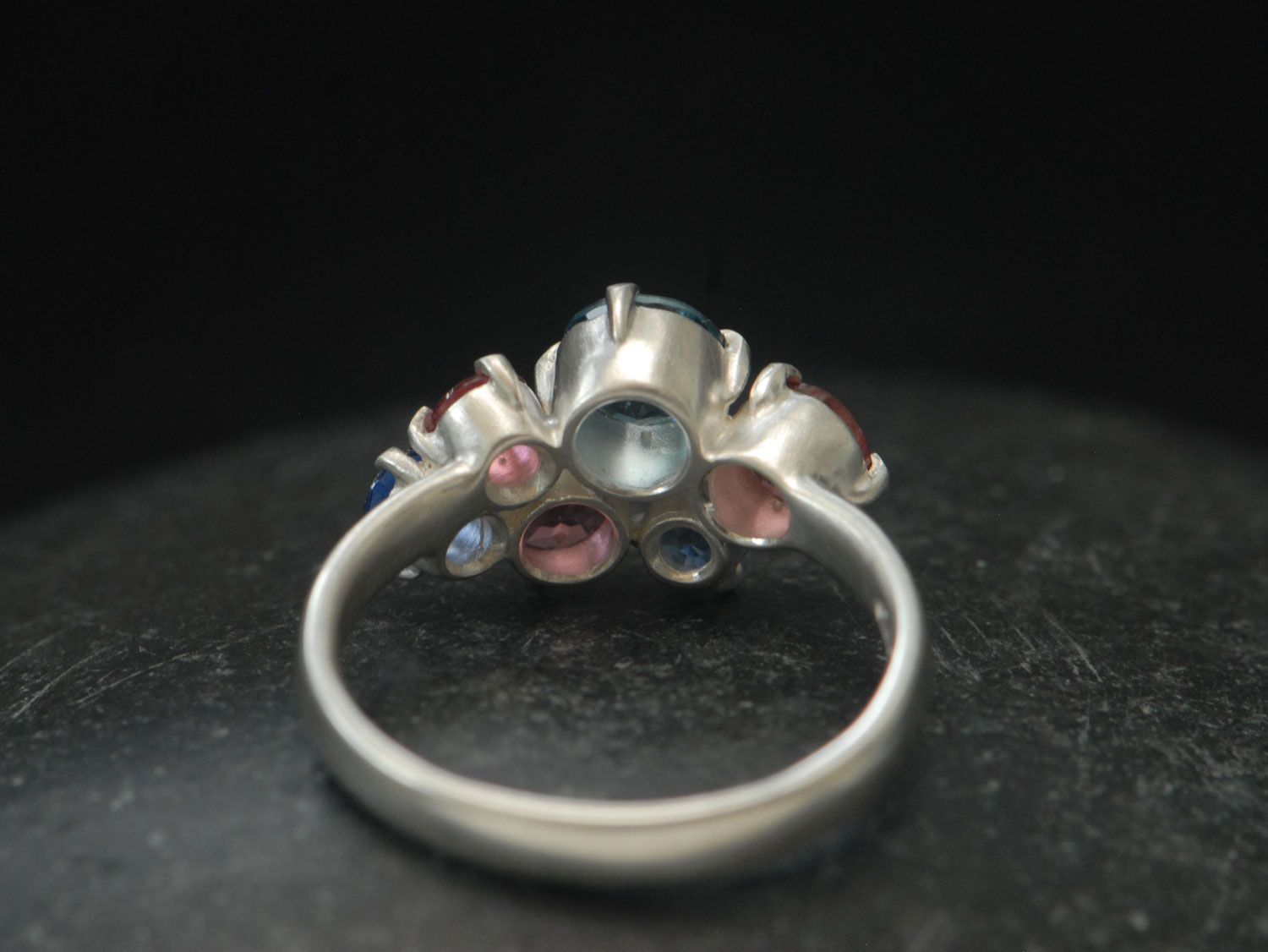 Topaz,-tourmailne-and-sapphire-cluster-ring-in-silver-reverse