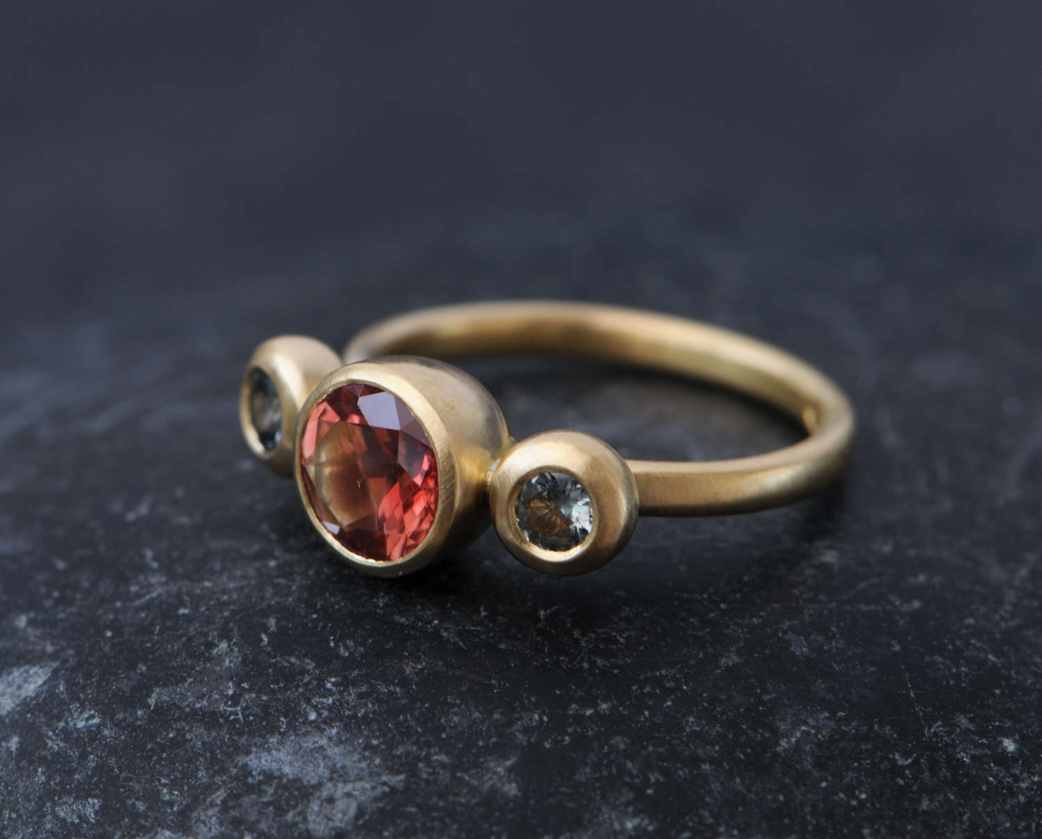 Triple-stone ring set with Montana sapphires and oregon sunstone