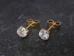 Moissanite 5mm stud earrings in 18K gold