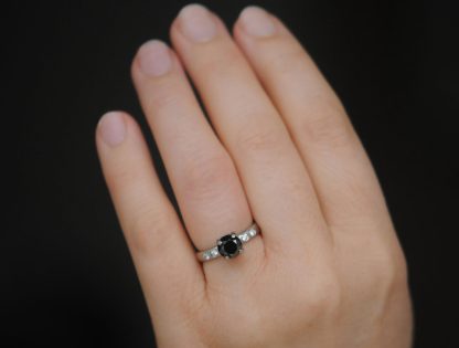 black-diamond-claw-ring-with-4-white-diamonds-in-platinum-closeup