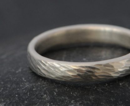 textured silver wedding band for her.