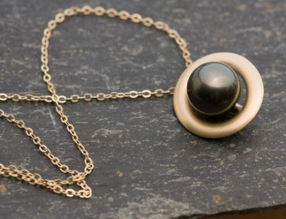 black pearl halo necklace in 9k gold