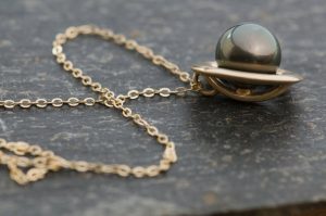 black pearl halo necklace in 9k gold