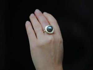 black tahitian pearl halo ring in 18K yellow gold