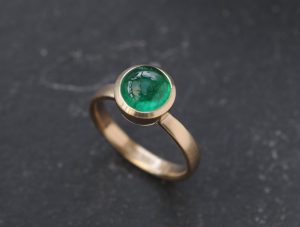 emerald 8mm cab ring in 18K gold