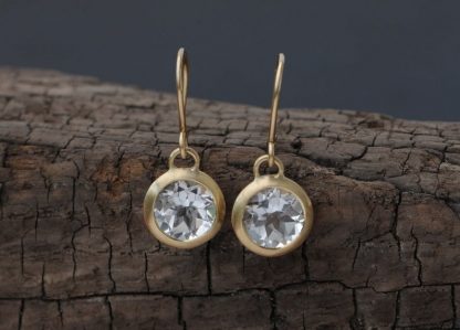 white topaz drop earrings in 18K yellow gold