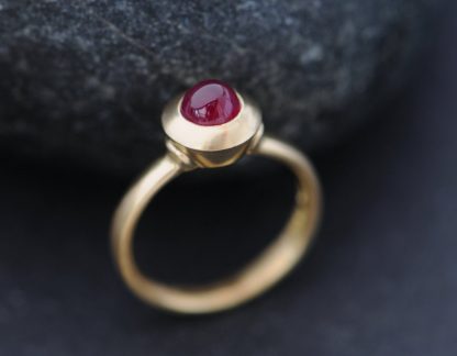 Beautiful Cabochon Ruby Ring set in satin finished 18K Gold. This ring is based on a medieval ring design, held in London's Victoria and Albert Museum. Natural Cabochon Ruby, wonderful deep pink colour. Untreated Cabochon Ruby is 5.5mm diameter and 1 carat This ring is made to order
