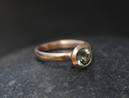 green sapphire 6.5mm halo set in 18K rose gold