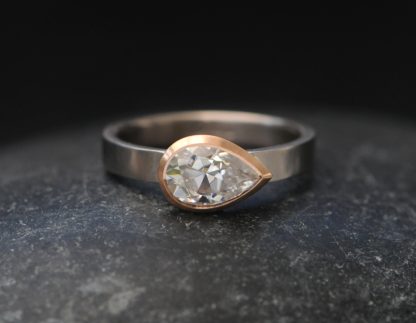 moissanite pear cut ring in mixed metals