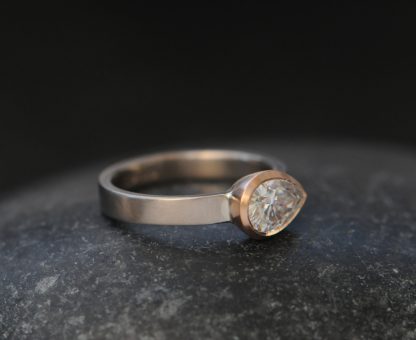 moissanite pear cut ring in mixed metals