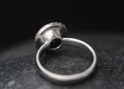 black-diamond-9mm-and-sapphire-halo-ring-in-platinum