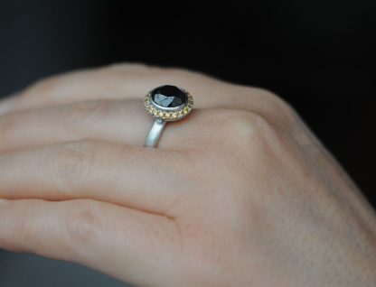 black-diamond-9mm-and-sapphire-halo-ring-in-platinum