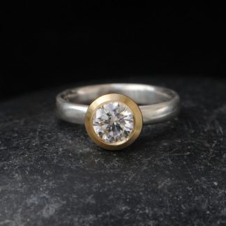 moissanite-7mm-halo-ring-in-18K-yellow-gold-and-silver-band
